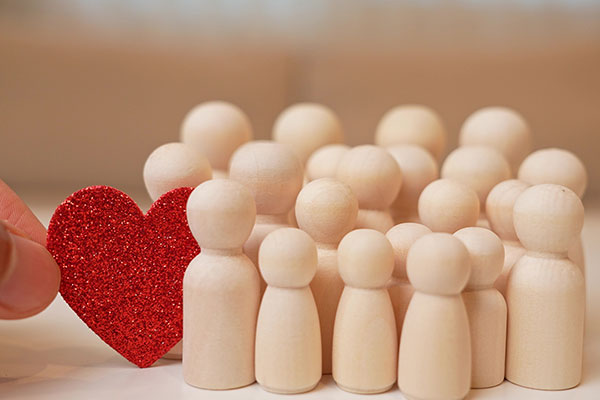 Heart with wooden people figures