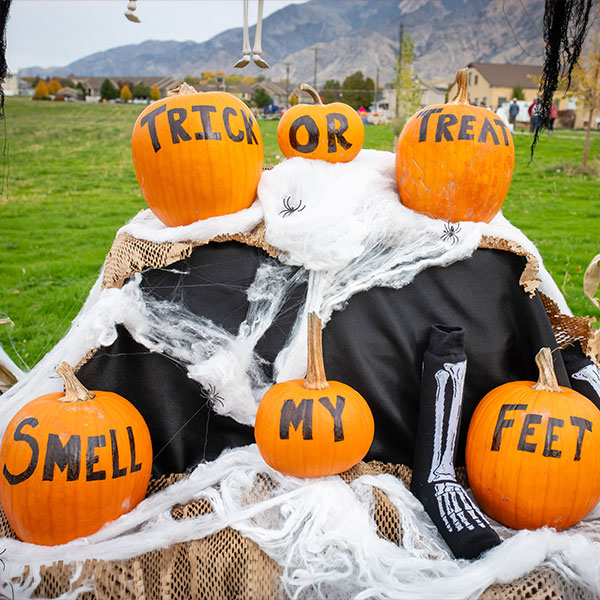 Tick or Tread Smell my Feet written on pumpkins