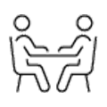 Two people talking at a table icon.